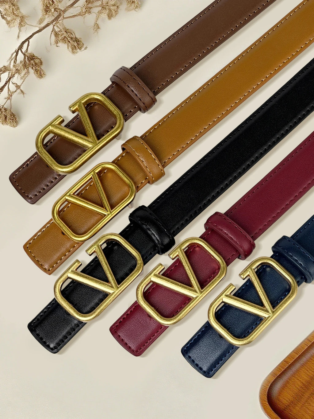 Women's belt with V letter alloy buckle, meticulously crafted from durable PU material. Featuring a sleek, modern design that ex