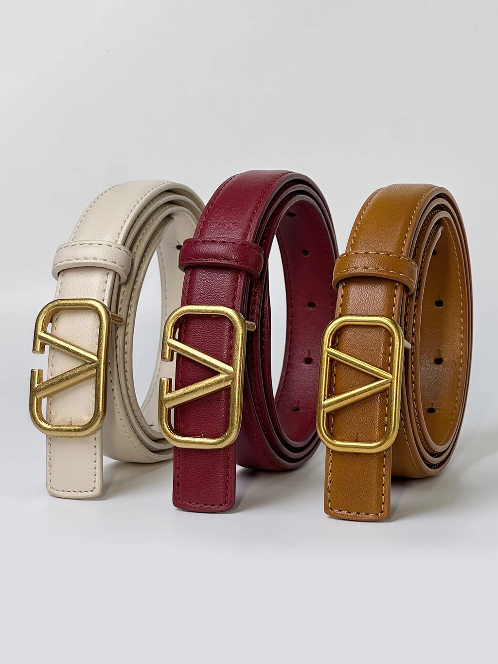 Women's belt with V letter alloy buckle, meticulously crafted from durable PU material. Featuring a sleek, modern design that ex