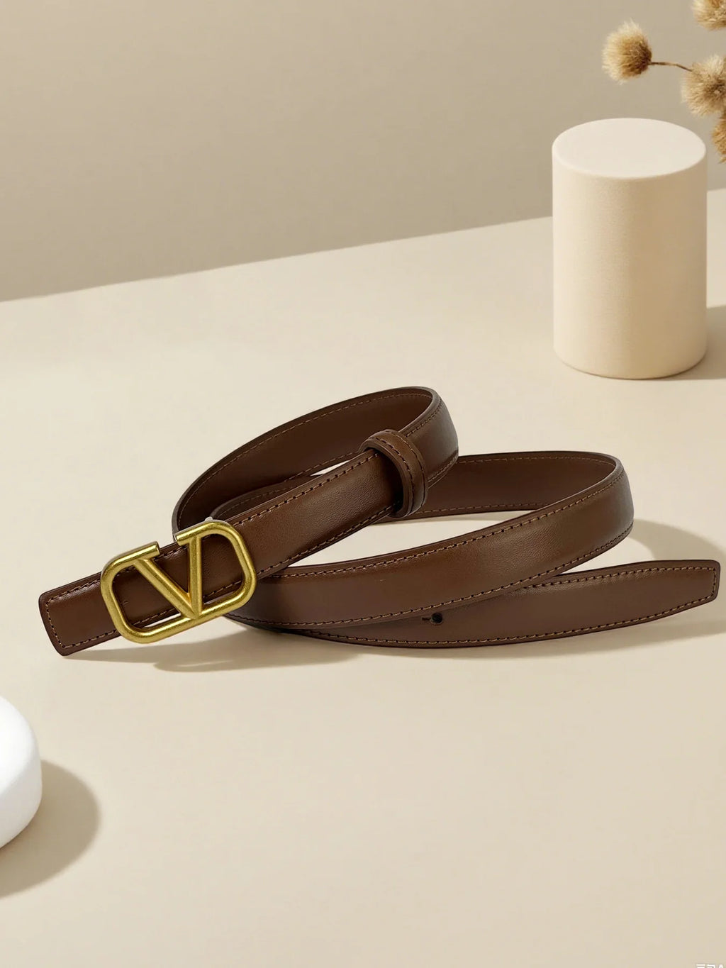 Women's belt with V letter alloy buckle, meticulously crafted from durable PU material. Featuring a sleek, modern design that ex